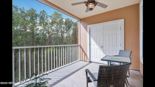 balcony featuring ceiling fan