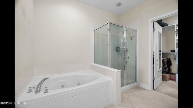 bathroom featuring tile patterned floors and independent shower and bath