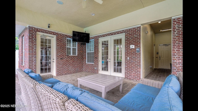 view of patio featuring french doors, ceiling fan, and outdoor lounge area