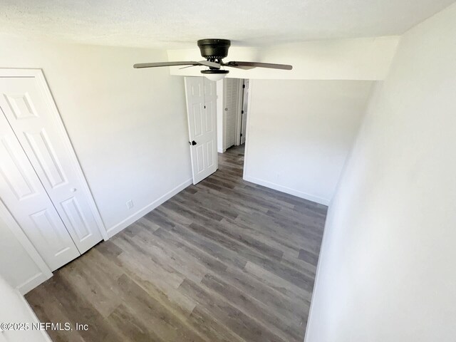 spare room with hardwood / wood-style floors and ceiling fan