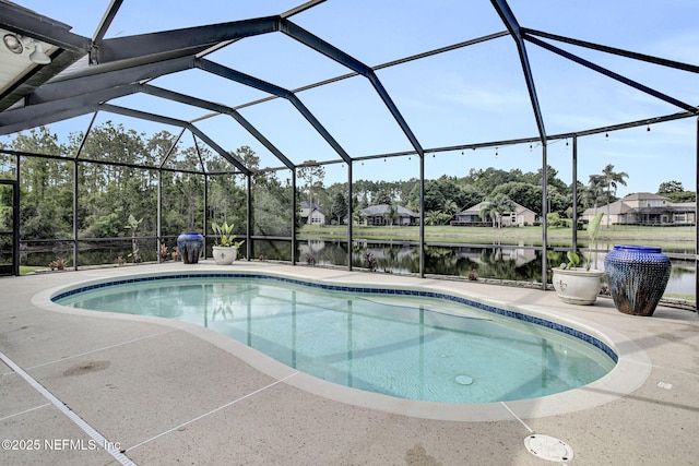 pool featuring a lanai, a water view, and a patio area