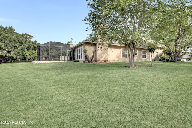 view of yard featuring a lanai