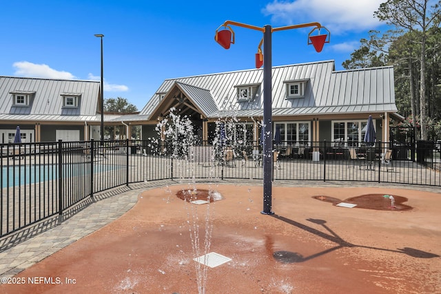surrounding community with a swimming pool and fence