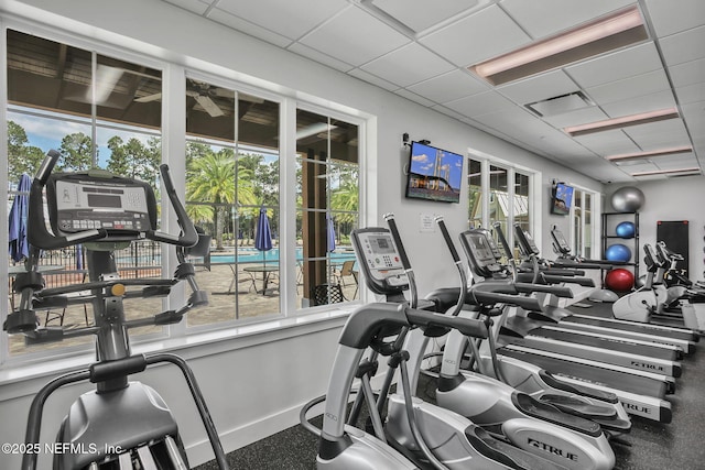 exercise room featuring a paneled ceiling