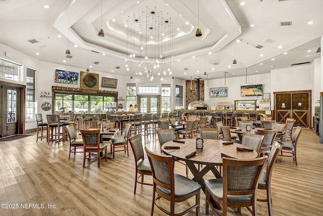dining room featuring recessed lighting and a towering ceiling