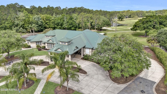birds eye view of property featuring a view of trees and golf course view