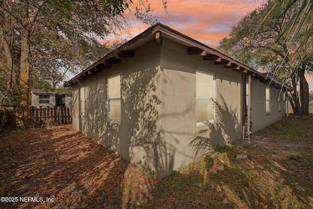 view of property exterior at dusk