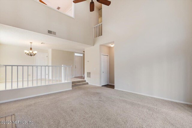 1706 Wood Hill Pl Unit 1706, Jacksonville, FL 32256 - carpeted empty room with ceiling fan with notable chandelier, visible vents, and baseboards
