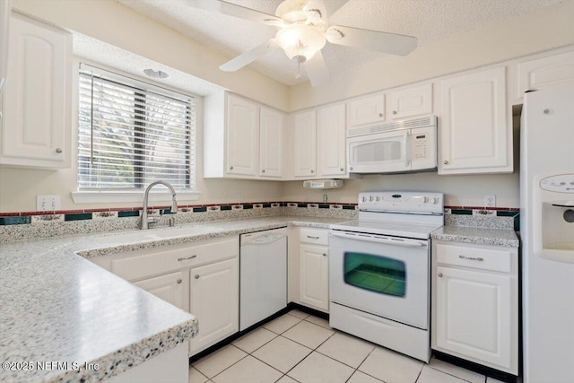 1706 Wood Hill Pl Unit 1706, Jacksonville, FL 32256 - kitchen with light countertops, white cabinetry, a textured ceiling, and white appliances