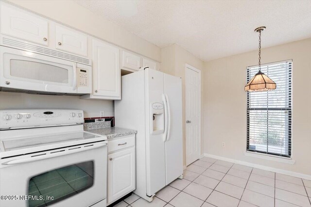 1706 Wood Hill Pl Unit 1706, Jacksonville, FL 32256 - kitchen featuring hanging light fixtures, white cabinets, and white appliances