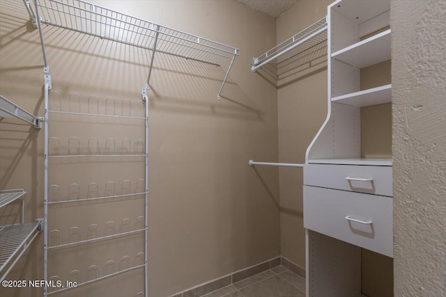 1706 Wood Hill Pl Unit 1706, Jacksonville, FL 32256 - spacious closet featuring tile patterned flooring