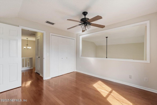 1706 Wood Hill Pl Unit 1706, Jacksonville, FL 32256 - unfurnished bedroom with baseboards, visible vents, a closet, and wood finished floors