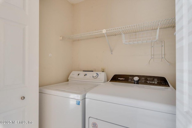1706 Wood Hill Pl Unit 1706, Jacksonville, FL 32256 - laundry area with independent washer and dryer and laundry area