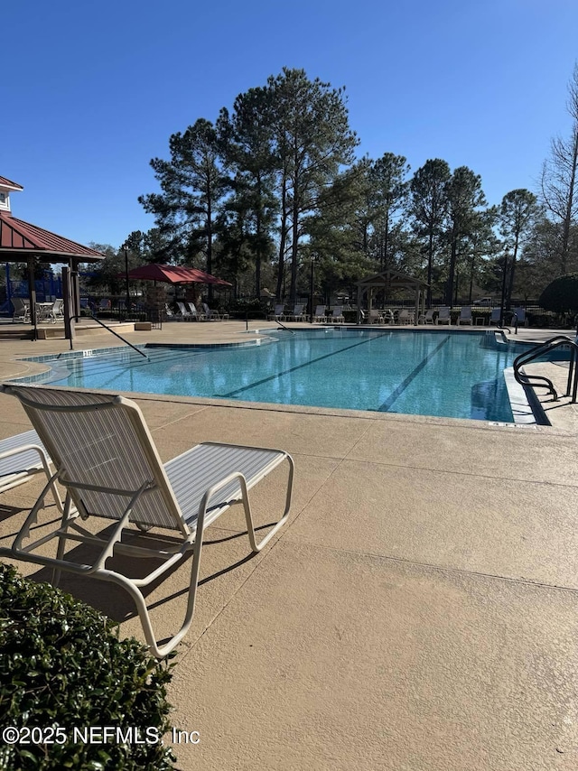 view of pool with a gazebo and a patio