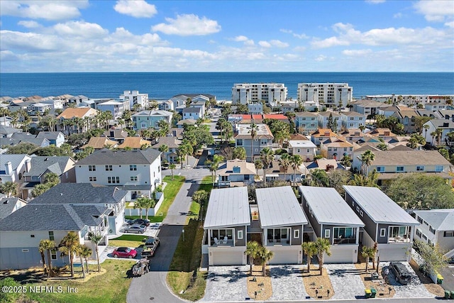 bird's eye view with a residential view and a water view