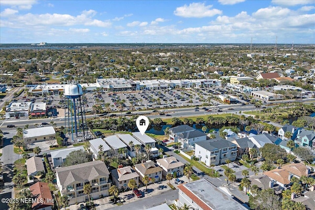 birds eye view of property with a residential view