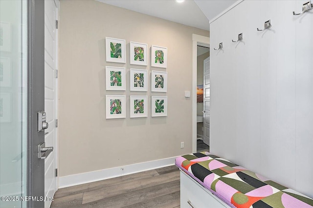 bedroom featuring dark wood-style floors and baseboards