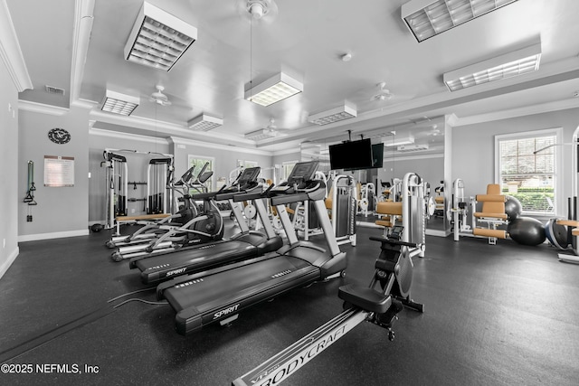 gym featuring ornamental molding, visible vents, and baseboards