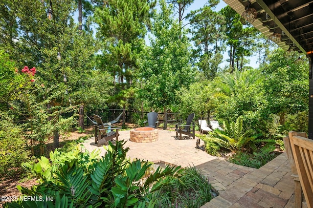 view of patio featuring an outdoor fire pit