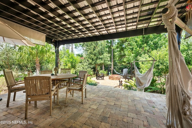 view of patio / terrace featuring an outdoor fire pit