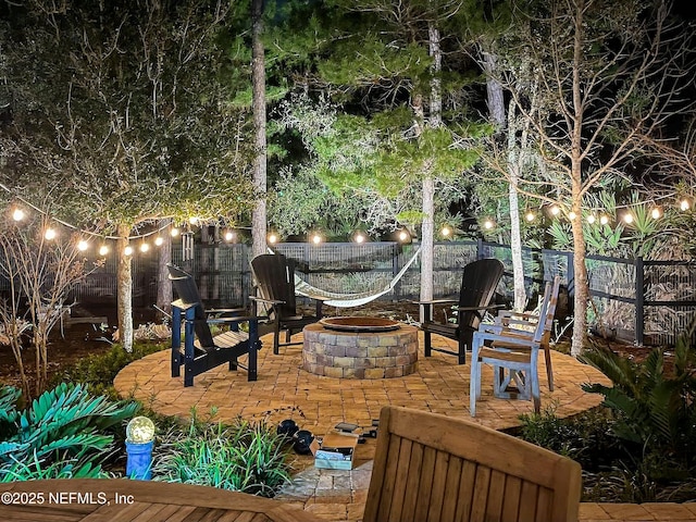 yard at twilight featuring a fire pit and a patio area