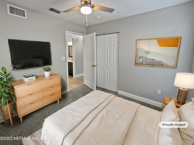 carpeted bedroom with a closet and ceiling fan