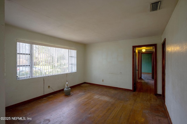 unfurnished room featuring wood-type flooring