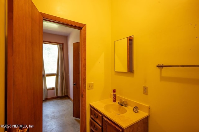 bathroom featuring vanity and concrete floors