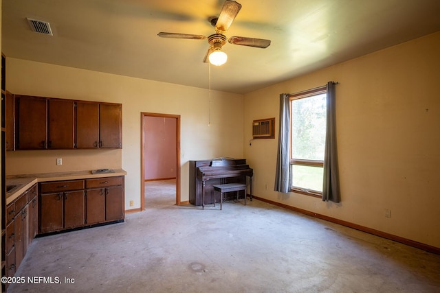 kitchen with a wall mounted AC and ceiling fan