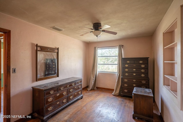 interior space featuring ceiling fan and wood-type flooring