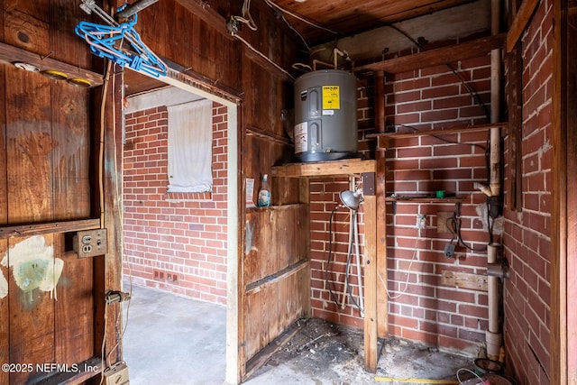 utility room featuring electric water heater