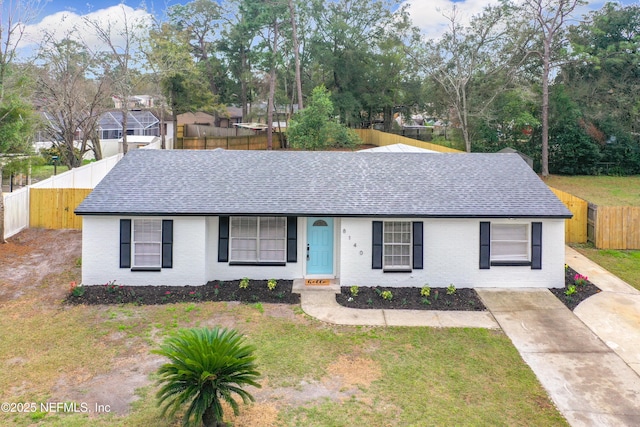 ranch-style house with a front lawn