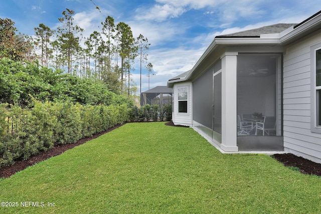 view of yard with a sunroom