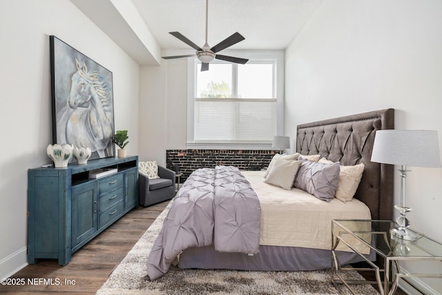 bedroom featuring dark wood-type flooring and ceiling fan