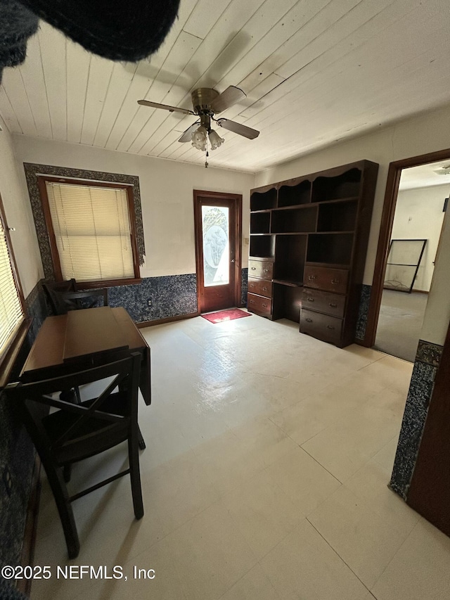 interior space featuring wood ceiling and ceiling fan