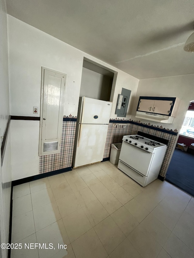 kitchen with white appliances, electric panel, and light tile patterned floors