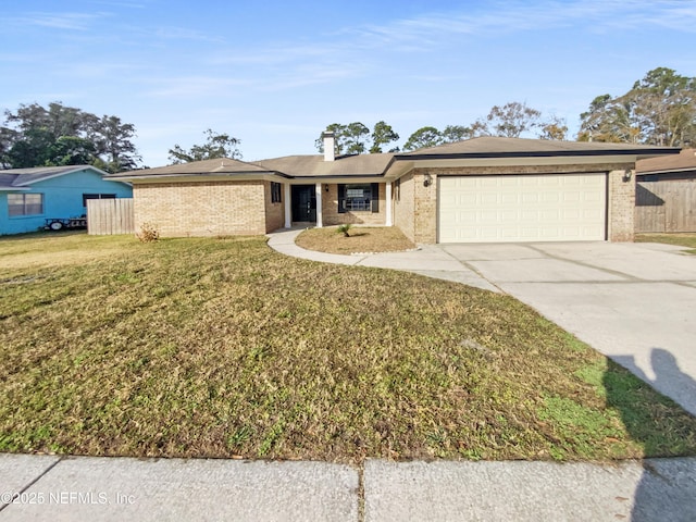 ranch-style home with a garage and a front yard