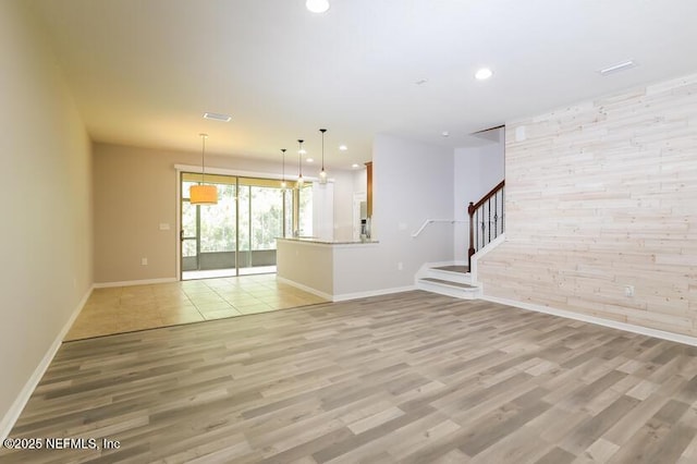 unfurnished living room featuring light wood-type flooring