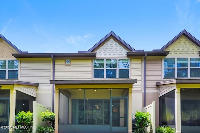 back of property featuring a sunroom