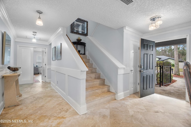 1387 Dunns Lake Dr, Jacksonville, FL 32218 - foyer featuring a notable chandelier, ornamental molding, and a textured ceiling
