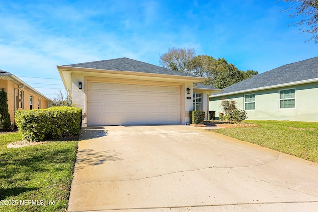 ranch-style home featuring driveway, roof with shingles, an attached garage, a front yard, and stucco siding