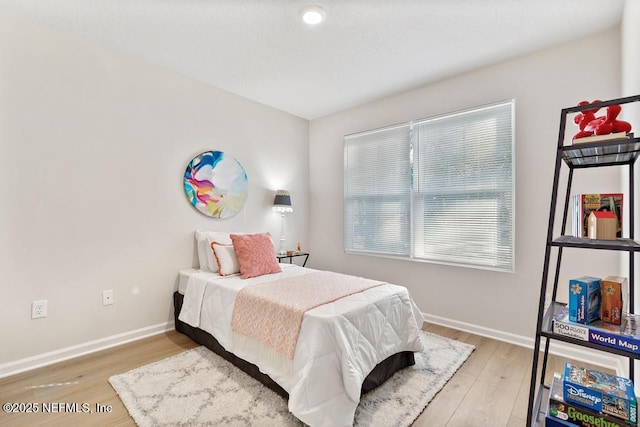 bedroom featuring wood-type flooring