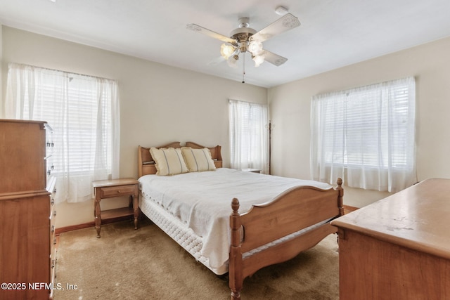 bedroom with ceiling fan and carpet flooring