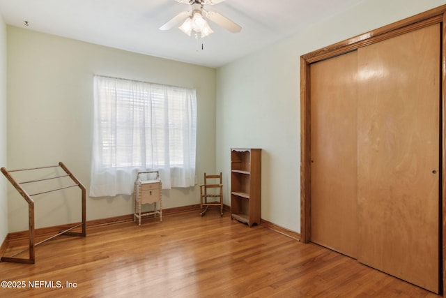 unfurnished room with ceiling fan and light wood-type flooring