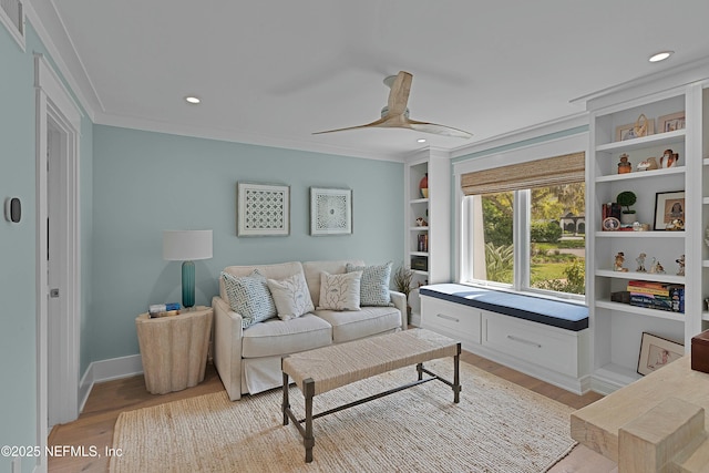 living area featuring light wood-style flooring, a ceiling fan, and recessed lighting