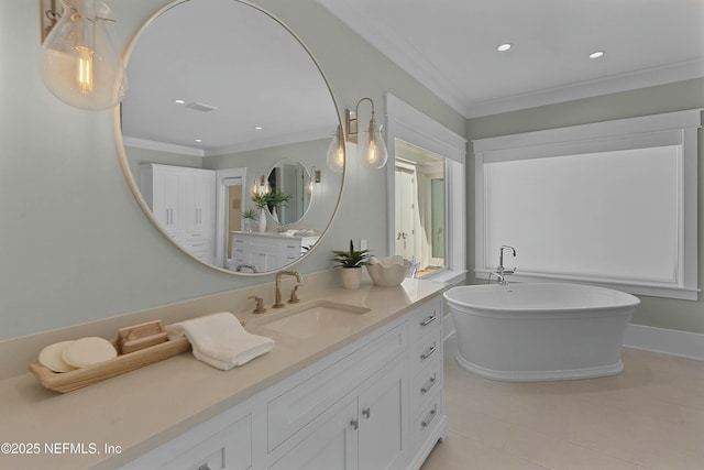bathroom with crown molding, a freestanding bath, vanity, and recessed lighting