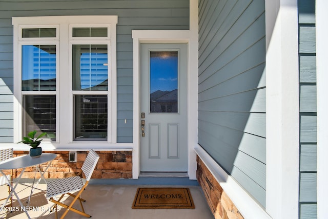 doorway to property with a porch