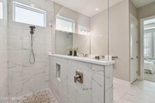 ensuite bathroom with plenty of natural light, ensuite bathroom, and walk in shower