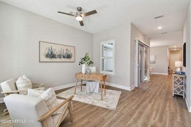 office with visible vents, baseboards, recessed lighting, light wood-style floors, and a ceiling fan