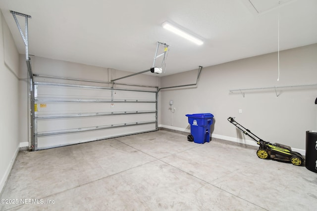 garage featuring baseboards and a garage door opener